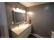 Bathroom vanity with framed mirror, storage, and contemporary design at 1255 Easy St, Greenwood, IN 46142