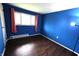Bright bedroom with hardwood floors and natural light from the window at 1255 Easy St, Greenwood, IN 46142