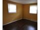 Empty bedroom with natural light, featuring hardwood floors and neutral walls at 1255 Easy St, Greenwood, IN 46142