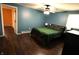 Bedroom featuring hardwood floors, comfortable furniture, and a well-lit ambiance at 1255 Easy St, Greenwood, IN 46142