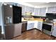 Contemporary kitchen featuring stainless steel appliances, stylish cabinetry, and a functional design at 1255 Easy St, Greenwood, IN 46142