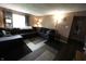 Comfortable living room featuring a large sectional couch and bright natural light at 1255 Easy St, Greenwood, IN 46142