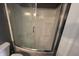 Clean shower area with glass door, featuring neutral tones at 1255 Easy St, Greenwood, IN 46142