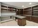 Finished basement office features custom cabinets, a desk, and built-in shelves at 13494 Moorcroft Dr, Fishers, IN 46037