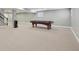 A spacious finished basement features a pool table, stairs, neutral carpeting, and recessed lighting at 13494 Moorcroft Dr, Fishers, IN 46037