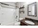 Bathroom with dark wood vanity and industrial pipe shelves at 13494 Moorcroft Dr, Fishers, IN 46037