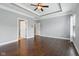 A primary bedroom features hardwood floors, tray ceiling, and two entry doors at 13494 Moorcroft Dr, Fishers, IN 46037