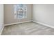 Bedroom with neutral carpet, light-colored walls, and a window at 13494 Moorcroft Dr, Fishers, IN 46037