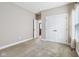 A vacant bedroom featuring a carpeted floor, a closet, and natural light from the window at 13494 Moorcroft Dr, Fishers, IN 46037