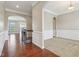 Home interior foyer showcasing archways, dark wood floors, and white trim at 13494 Moorcroft Dr, Fishers, IN 46037