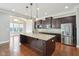Kitchen with granite countertops, stainless appliances and dark wood cabinetry at 13494 Moorcroft Dr, Fishers, IN 46037
