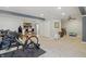 Basement with workout area, storage, and bar for entertaining at 1575 Oakvista Dr, Greenwood, IN 46143