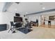 Basement with work out area and bar for entertaining at 1575 Oakvista Dr, Greenwood, IN 46143