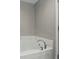 A bathtub with chrome fixtures at 1575 Oakvista Dr, Greenwood, IN 46143