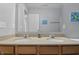Bathroom featuring double sinks, ample counter space, and neutral decor at 1575 Oakvista Dr, Greenwood, IN 46143