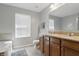 Well-lit bathroom featuring double sinks, vanity, soaking tub and tile floors at 1575 Oakvista Dr, Greenwood, IN 46143