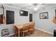 Basement dining area with wooden table, four chairs, and a ceiling fan at 1575 Oakvista Dr, Greenwood, IN 46143