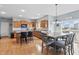 Eat-in kitchen with wood cabinetry, stainless steel appliances, an island, and a dining area at 1575 Oakvista Dr, Greenwood, IN 46143