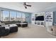 Bright living room with large windows, a comfortable sectional sofa, and built-in shelving at 1575 Oakvista Dr, Greenwood, IN 46143
