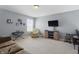 Open concept living space featuring natural light, seating, and tv at 1575 Oakvista Dr, Greenwood, IN 46143