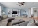 Spacious living room with a large sectional sofa, built-in entertainment center, and neutral decor at 1575 Oakvista Dr, Greenwood, IN 46143