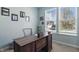 Bright home office with a large desk, natural light, and tasteful decor for a productive workspace at 1575 Oakvista Dr, Greenwood, IN 46143