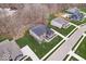 Aerial view of a beautiful home with spacious front and back yards, plus a stone patio at 16193 Burnt Rock Ln, Fortville, IN 46040