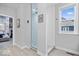 Bright bathroom featuring a glass shower with white subway tile and a window with natural light at 16193 Burnt Rock Ln, Fortville, IN 46040
