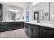 Stylish bathroom featuring double vanities with black cabinets, white countertops and modern fixtures at 16193 Burnt Rock Ln, Fortville, IN 46040