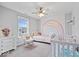 Bright bedroom with a rainbow mural and comfortable furnishings at 16193 Burnt Rock Ln, Fortville, IN 46040