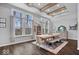 A dining room with hardwood floors, recessed lighting, beam ceilings, and large windows at 16193 Burnt Rock Ln, Fortville, IN 46040