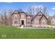 Charming brick two-story home with a well-manicured lawn and a professionally landscaped front yard at 16193 Burnt Rock Ln, Fortville, IN 46040