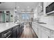 A modern kitchen featuring stainless appliances, island sink, hardwood floors and ample counter space at 16193 Burnt Rock Ln, Fortville, IN 46040