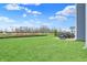 Backyard of the home featuring patio furniture, new construction, and a grassy lawn at 1691 Beyers St, Fortville, IN 46040