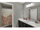 Bathroom featuring double vanity sinks and shower with printed curtain at 1691 Beyers St, Fortville, IN 46040