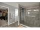 Bright bathroom features a large shower stall with glass doors and gray tile at 1691 Beyers St, Fortville, IN 46040