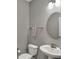 Half bath featuring a modern vanity and sink with great lighting at 1691 Beyers St, Fortville, IN 46040