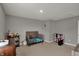 This carpeted room features furniture and toys at 1691 Beyers St, Fortville, IN 46040