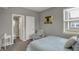 Bedroom featuring a view of the bathroom and a window letting in natural light at 1691 Beyers St, Fortville, IN 46040
