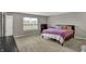 Spacious bedroom features neutral walls, carpet, and large window at 1691 Beyers St, Fortville, IN 46040
