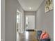 Bright foyer with hardwood floors, a stylish bench, and a view of the front door at 1691 Beyers St, Fortville, IN 46040