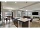 Bright, open-concept kitchen with a white countertop island and stainless steel dishwasher at 1691 Beyers St, Fortville, IN 46040