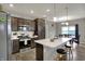 Modern kitchen with stainless steel appliances and eat-in island at 1691 Beyers St, Fortville, IN 46040