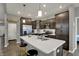 Contemporary kitchen with stainless steel appliances and a large white countertop island at 1691 Beyers St, Fortville, IN 46040