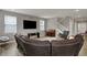 Spacious living room features hardwood floors, windows, and staircase at 1691 Beyers St, Fortville, IN 46040