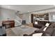 Open-concept living room with hardwood floors and comfortable seating and staircase at 1691 Beyers St, Fortville, IN 46040