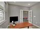 Office space featuring neutral walls, a large desk, and a view into the hallway at 1691 Beyers St, Fortville, IN 46040