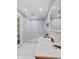 Bathroom features modern design with large sink, open shower with glass and white tile at 1707 W 76Th Pl, Indianapolis, IN 46260