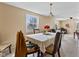 Dining room with table and chairs, beige walls, and natural light at 1707 W 76Th Pl, Indianapolis, IN 46260