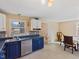 Kitchen with stainless steel dishwasher, ample counter space and natural light at 1707 W 76Th Pl, Indianapolis, IN 46260